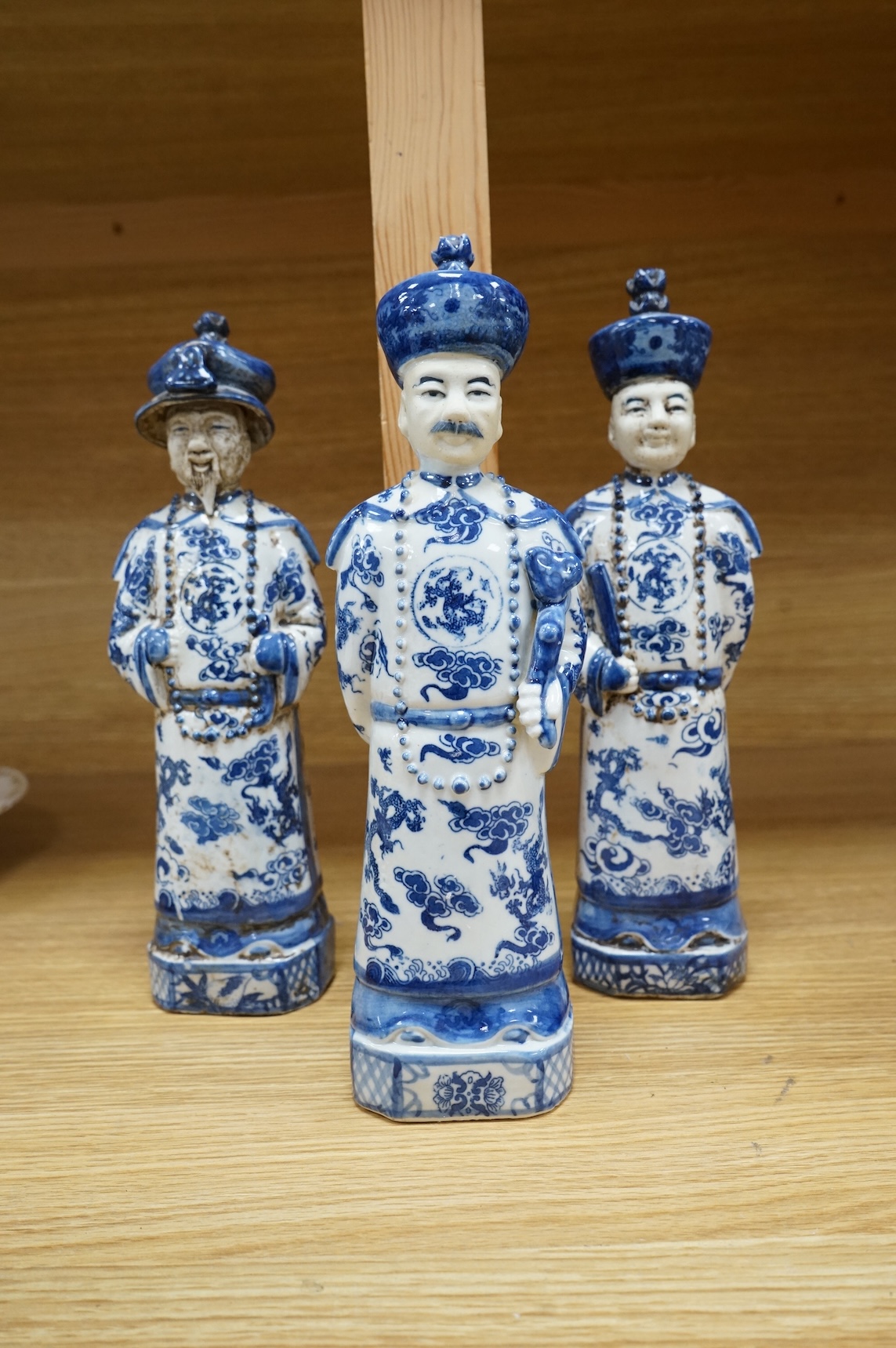 Three Chinese blue and white porcelain figures H 29cm x 9cm., and a Delft tobacco jar H 26cm W 18cm